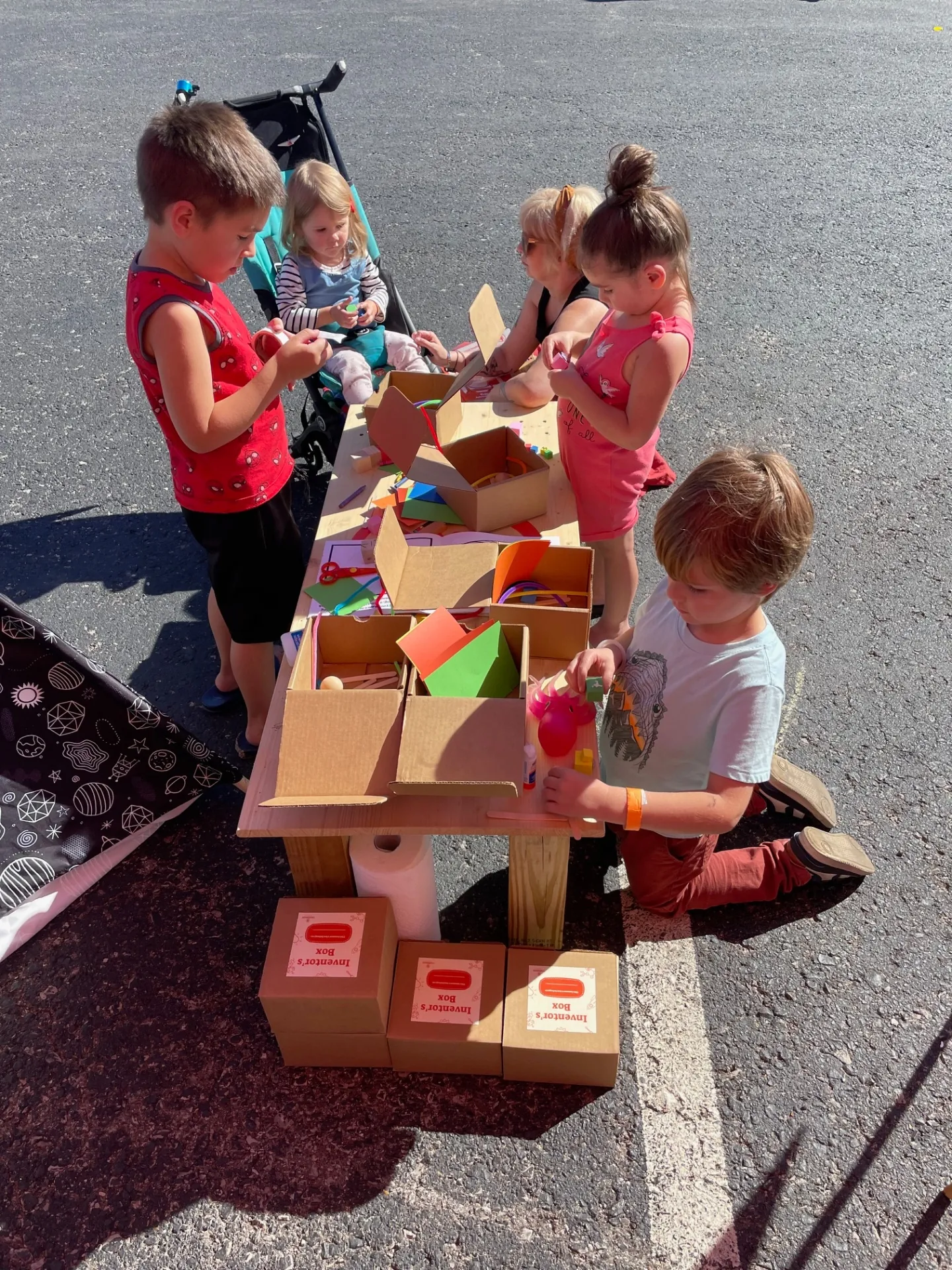 Kids building with an inventor's box